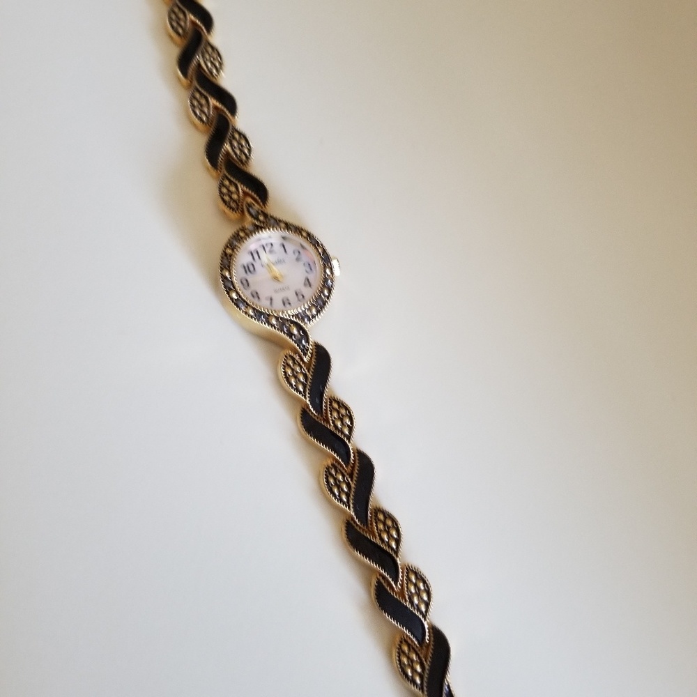 Blk and goldtone watch